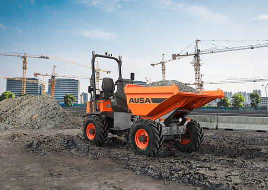 An orange Ausa dumper truck with a swivel tip skip, folding Rops bar, and visible safety beacons, parked on a construction site.